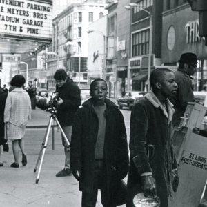 Steve Carver, setting up a shot with a tripod, Curtis Wilson, and Harry Wilson in downtown St. Louis during production of "More Than One Thing"