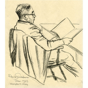Man Wearing Glasses Sitting In Chair Reading Magazine