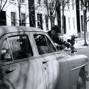 Steve Carver shooting footage from the front bumper of a car being driven by Billy Towns during production of "More Than One Thing"