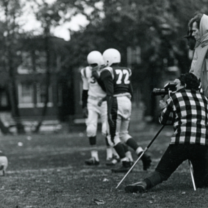 Steve Carver and  Lawrence Hagan, production assistant,  shooting footage of Billy Towns' little league football game during production of "More Than One Thing"
