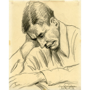Man Holding Head While Reading At Table